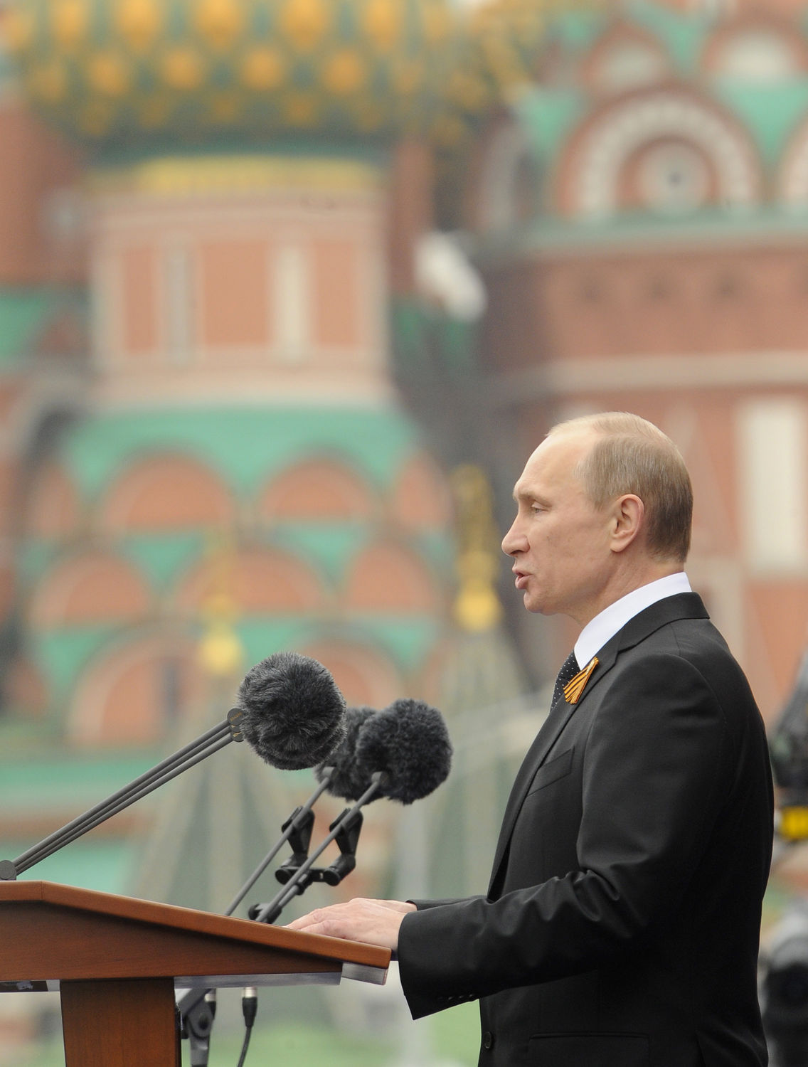 Russian President Putin and PM Medvedev attend the Victory Day parade