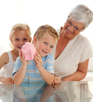 Grandmother and children saving money