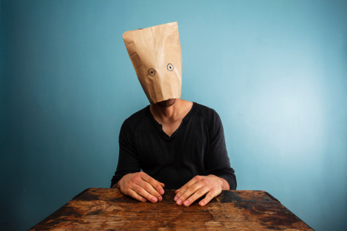 Stupid man with bag over his head