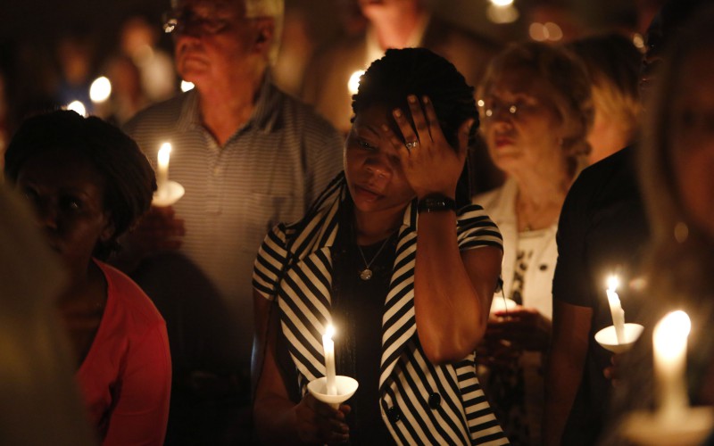 Mamie Mangoe, a friend of the Duncan family, wipes a tear away during a memorial service for Ebola victim Thomas Eric Duncan in Dallas on Wednesday, Oct. 8, 2014. (Nathan Hunsinger/Dallas Morning News/MCT)