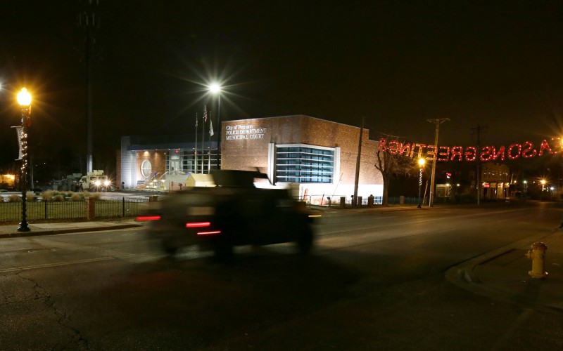A Missouri National Guard Humvee rolls past the Ferguson Police department during a patrol on South Florissant Road in Ferguson at 11:20 p.m. on Monday, Dec. 1, 2014. The streets of Ferguson had little to no foot traffic and no sustained protests of any kind on Monday night. (David Carson/St. Louis Post-Dispatch/TNS)
