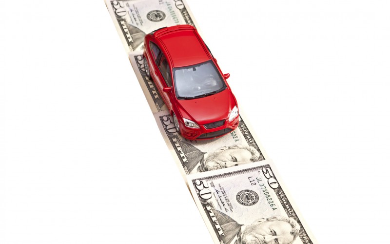 Red car on the money road, isolated - gas tax illustration