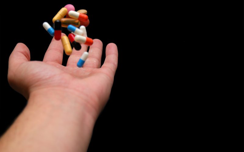 pills in human hand