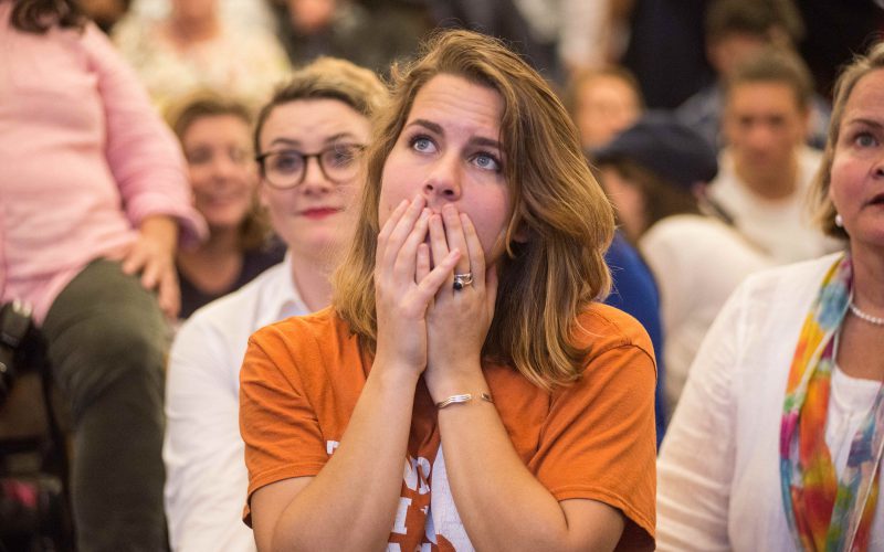 A Hillary Clinton supporter watches in disbelief as results roll in, during an election night watch party on November 9, 2016 in Austin, Texas. (Sandy Carson/Zuma Press/TNS)